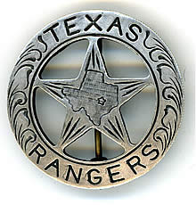 A silver circle star badge with the word "Texas" across the top of the circle and the word "Rangers" across the bottom. In the center of the star is the shape of the state of Texas.