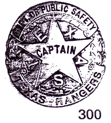 A drawing of a circular badge with a star in the center and leaves along the side. Alternating with the points of the star are the letters that spell "Texas" and in the center of the star is the word "Captain". Accross the top of the star are the words "Dept. of Public Safety". Across the bottom of the circle are the words "Texas Rangers".