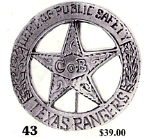 A silver circle star badge with the words "Dept. of Public Safety" across the top of the circle and the words "Texas Rangers" across the bottom. There are two branches going up the sides of the circle. In the middle of the star is the words "Co B" and there are decorative swirls in the star.