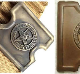 A brass belt buckle with a simplified circle star badge in the middle. In one photograph it is attached to a khaki canvas belt.