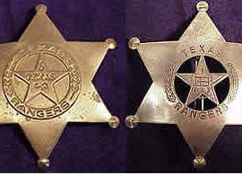 Two gold sheriff's star shaped badges. One with the circle star shape in the middle with the Texas Flag in the middle of the star, branches on the sides of the circle, and the words "Texas Ranger" on the top and bottom. The other with the circle star shape in the middle with the word "Texas" in the middle of the star, branches on the sides of the circle, and the words "Texas Ranger" on the top and bottom.