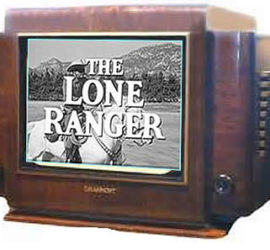 Vintage brown tv with a black and white image on the screen of a man in a cowboy hat on a white horse with the words "The Lone Ranger" printed across the screen.