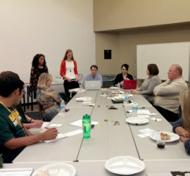 A group of people attending a training.