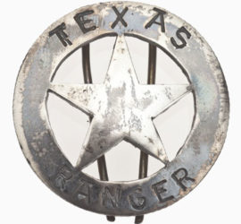 A silver circle star badge with the word "Texas" across the top and "Ranger" across the bottom.