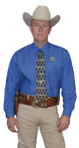 Ranger Cawthon in blue shirt and khaki pants uniform