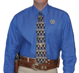Ranger Cawthon in blue shirt and khaki pants uniform