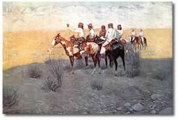 A group of Apache Native Americans on horses in a desert landscape.