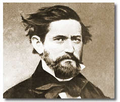 A sepia toned head shot of a bearded man in a dark suit.