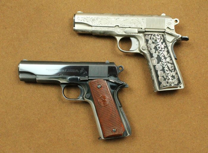 Two automatic pistols. One is a dark gunmetal color with wooden carved grips and the is a light silver colored metal with metal grips decorated with cacti and the words "Texas Ranger".