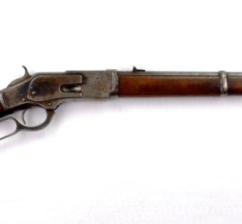 A wooden and silver metal rifle