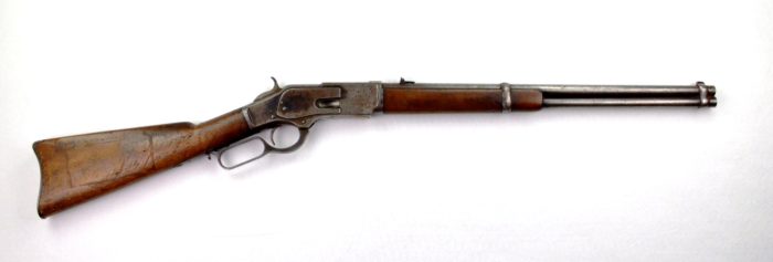 A wooden and silver metal rifle