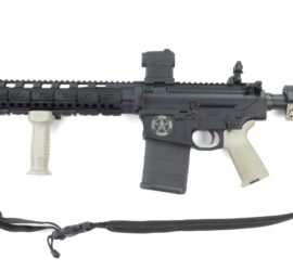 A grey assault rifle with cream tan accents and the Texas Ranger badge inscribed on it.