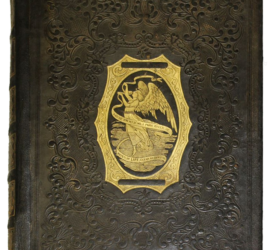 A dark brown book with embossing across the cover and a gold center illustration with an angel.