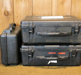Three large black box shaped containers with handle with the words "Company B" on it.