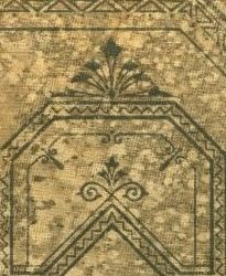A tan surface with blue/black geometric designs on it.