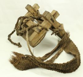 wood tent shaped pack saddle with leather ropes