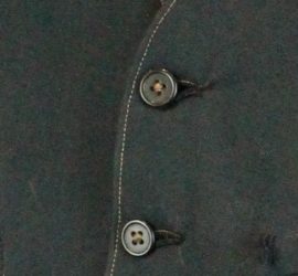 soft black fabric with two buttons