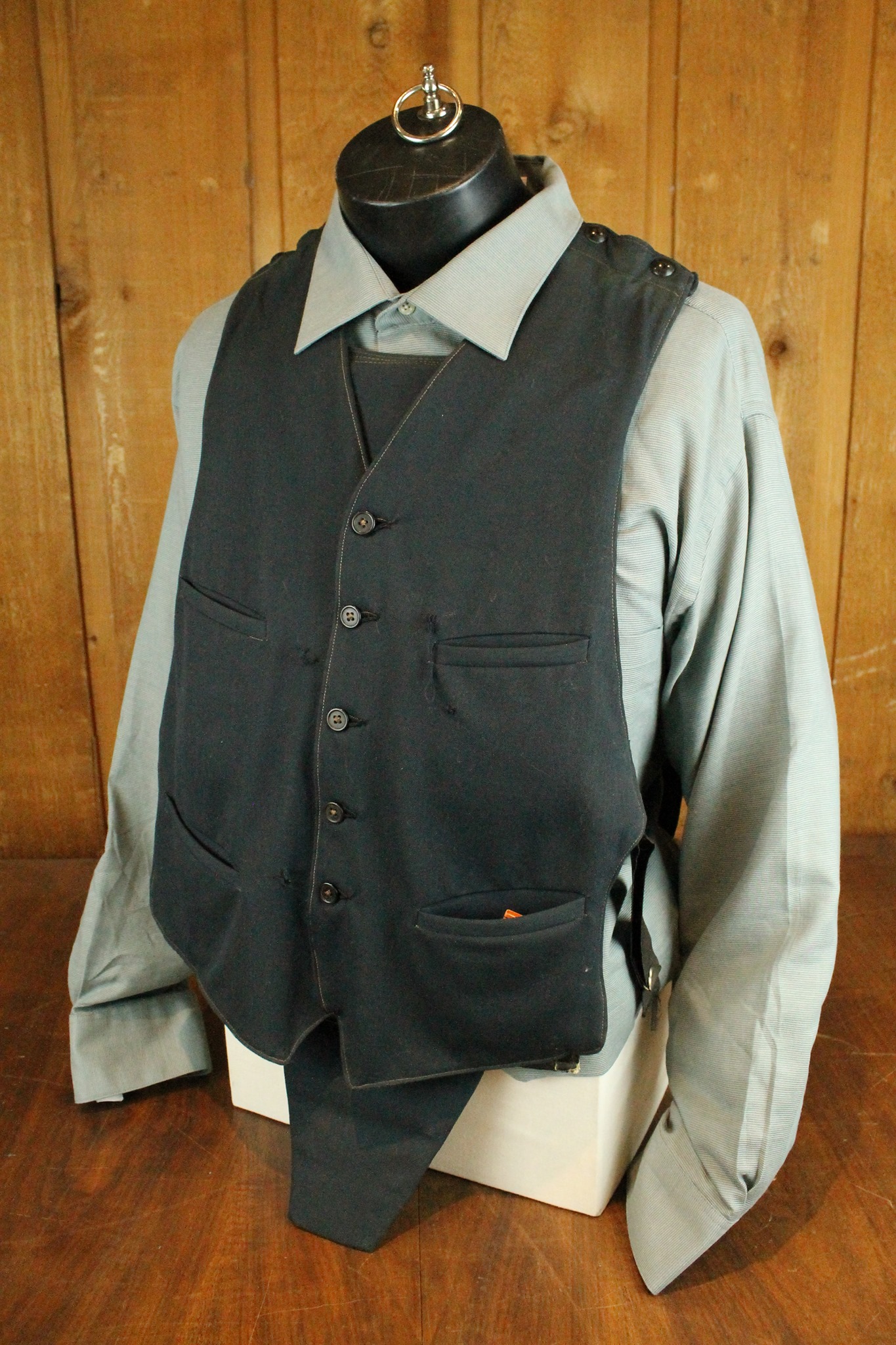 soft black vest with 5 buttons and 4 pockets