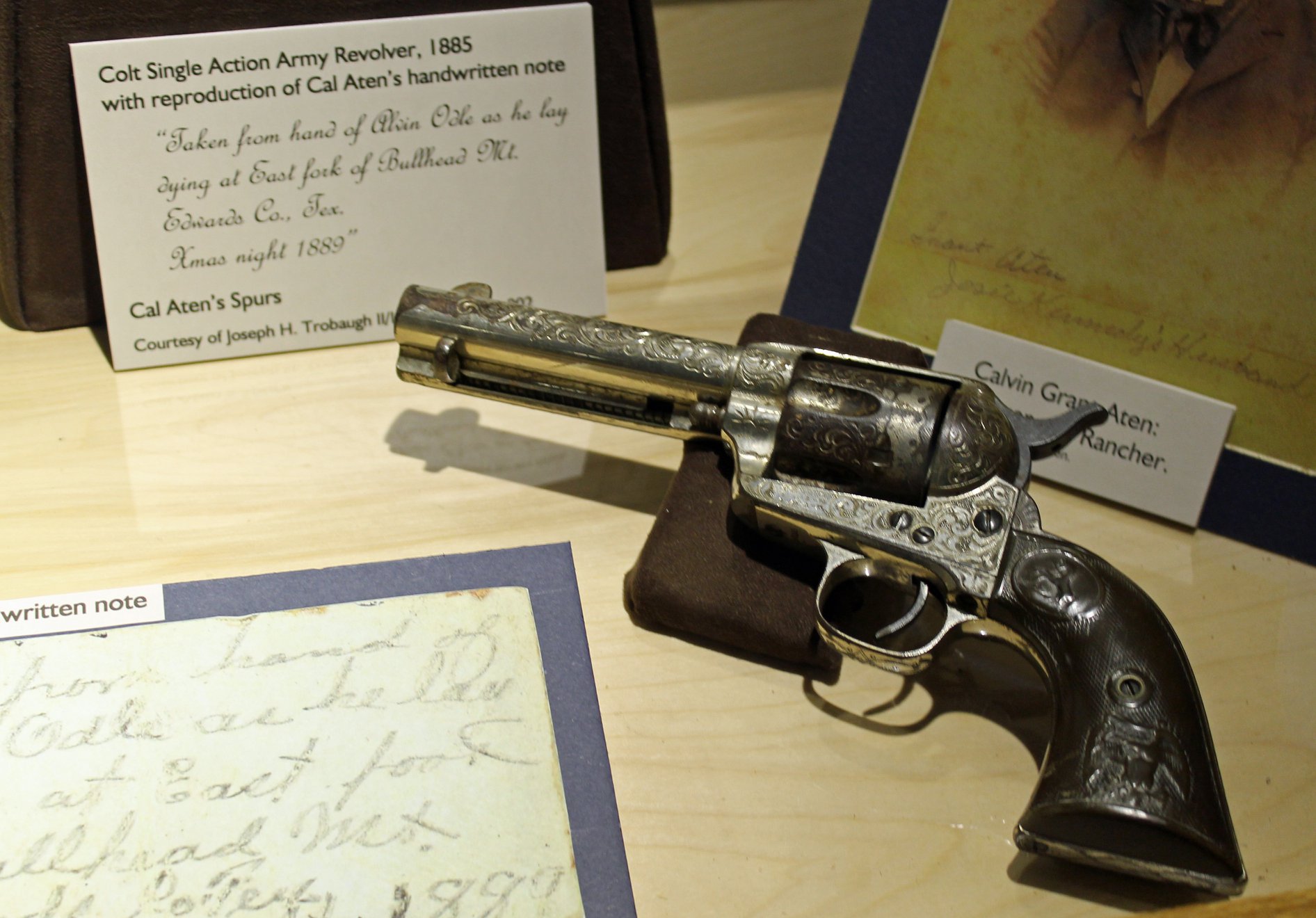 silver revolver with dark grip