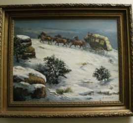 Stagecoach and horses climb snowy hilltop