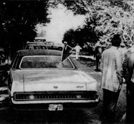 The Houston Family car with bullethole indicated, and people standing nearby.