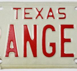 Texas Ranger License Plate from 1969 with red lettering on white metal