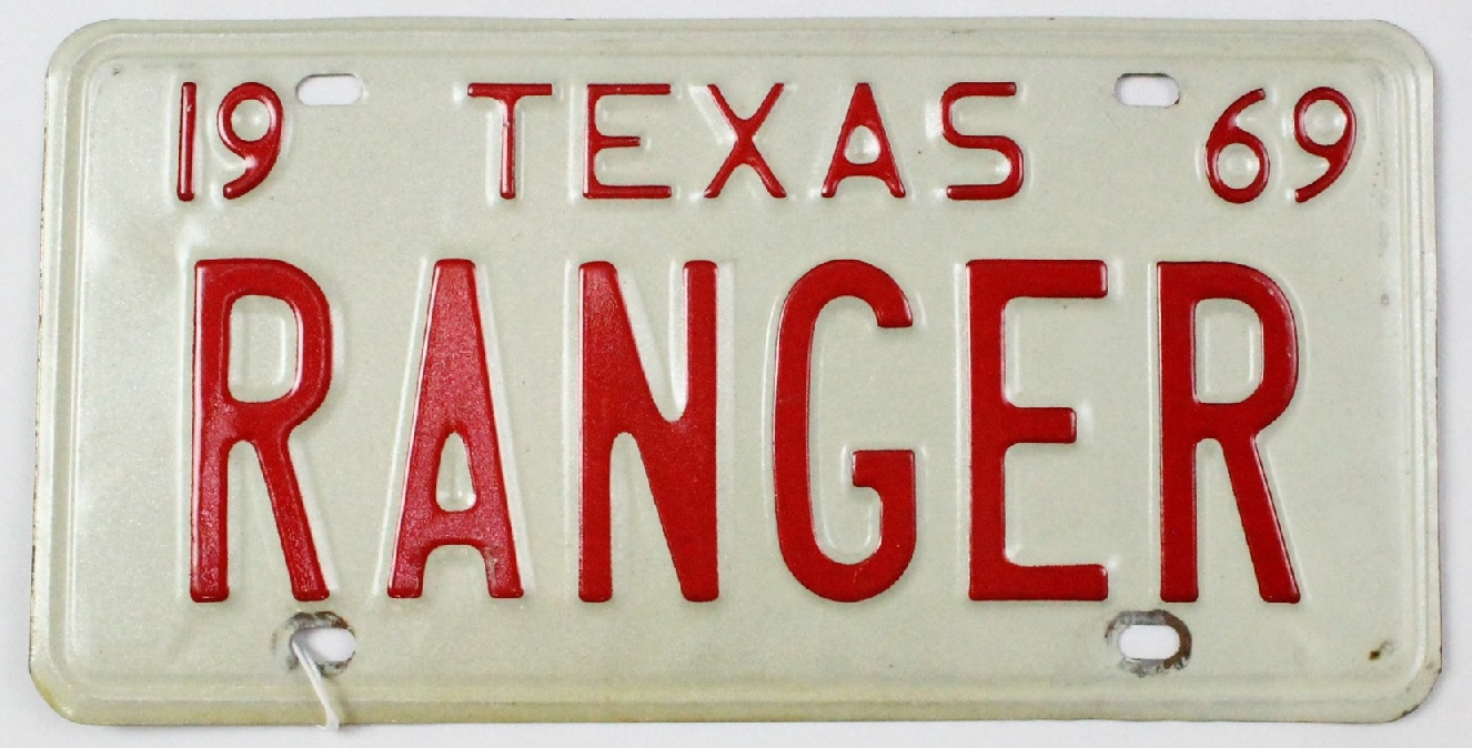 Texas Ranger License Plate from 1969 with red lettering on white metal