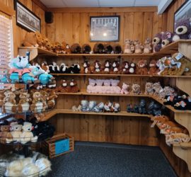 plush animals on shelves in gift shop