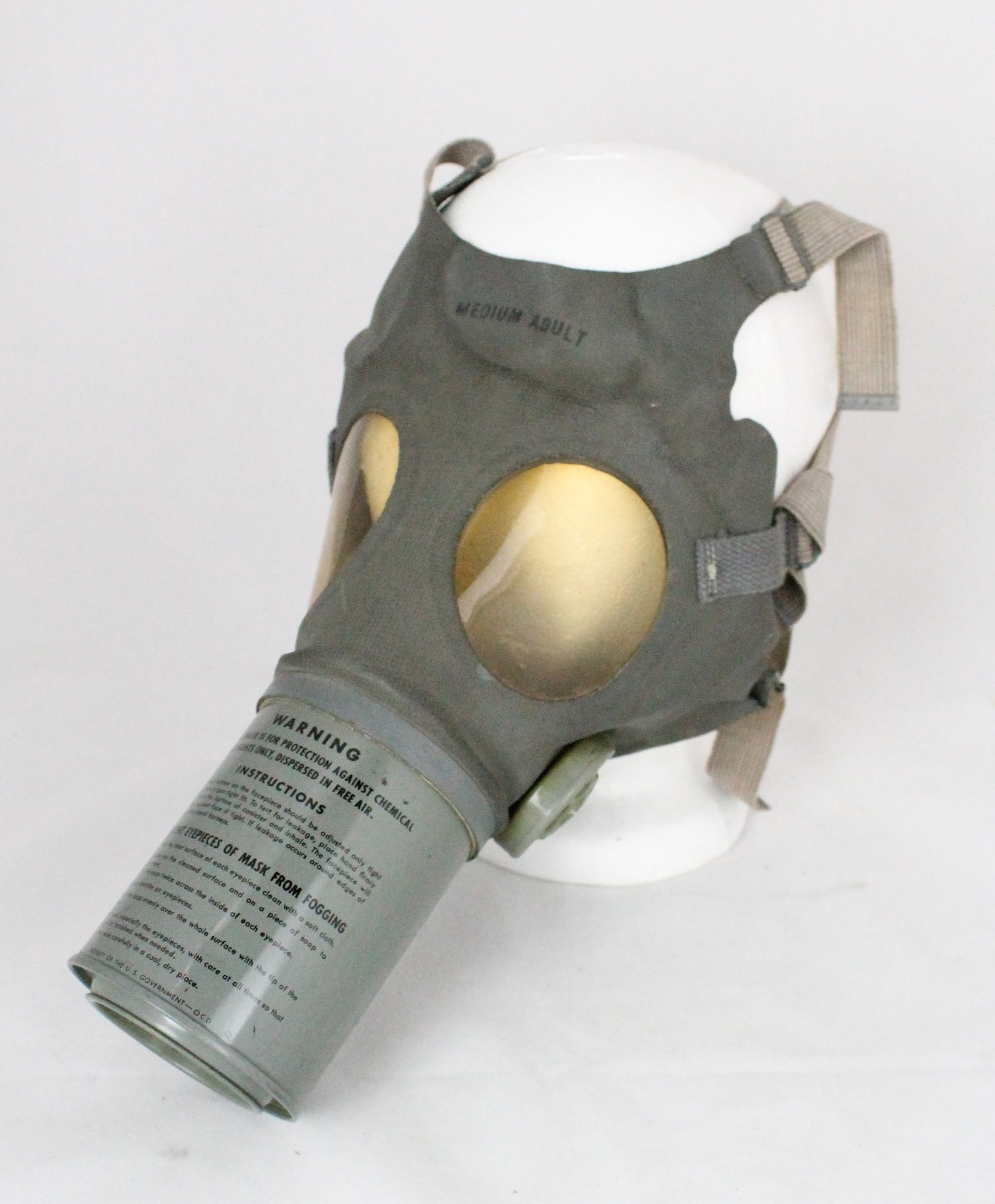 gray gas mask with straps and clear eye holes