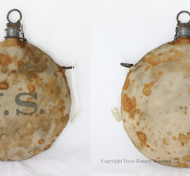 Round canteen with stained brown canvas wrapping and gray U.S. lettering on front