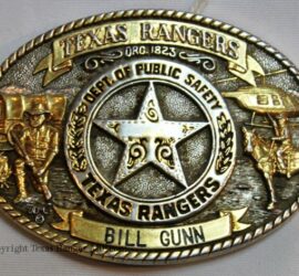 brass, oval belt buckle with badge in the center, a frontier Ranger on the left, and modern Ranger on the right