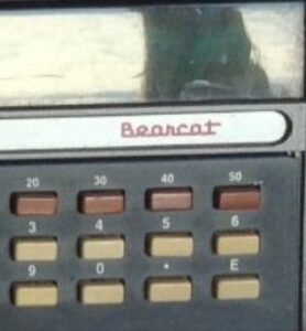 rows of rectangular push buttons on a bearcat branded machine