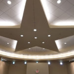 The ceiling of a round building with a large star in the center.